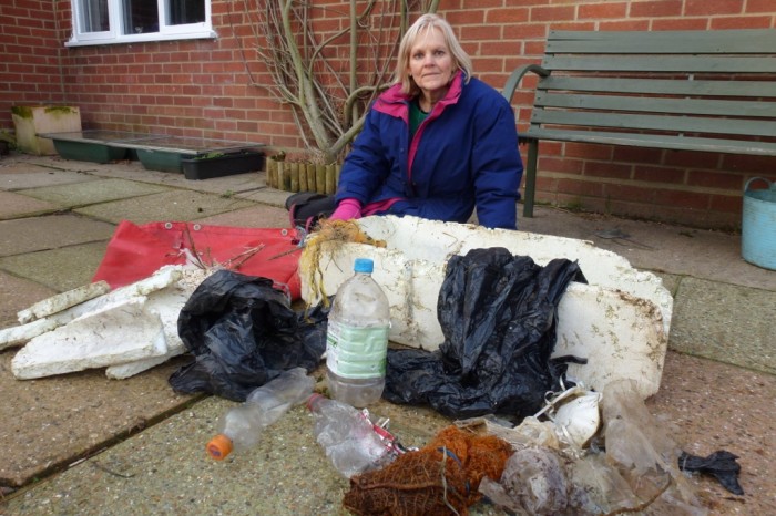 EIA Director Jennifer Lonsdale with the plastic debris she retrieved from Blakeney Marshes © J Lonsdale