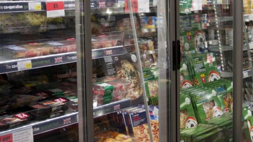 Supermarket aisle with refrigerators