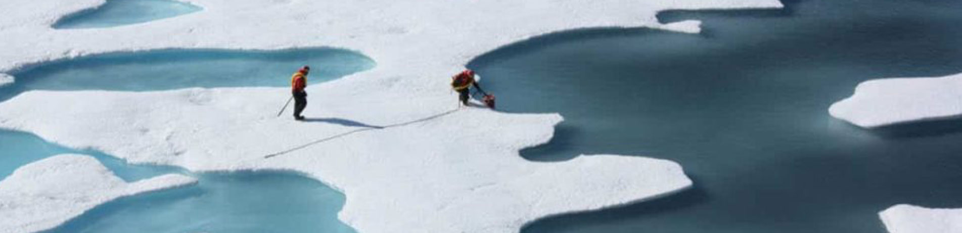 Scientists taking measurements on polar ice